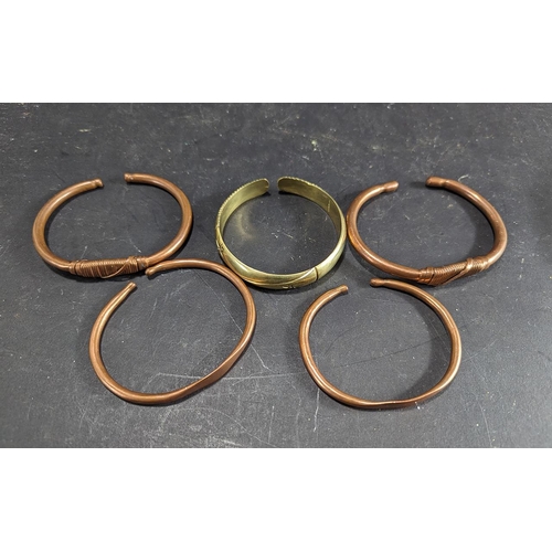 439A - Five Hand Made Copper & Brass African Bangles, assorted finishes.