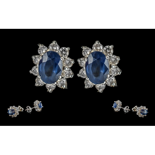 53A - Ladies - Fine Pair of 18ct Gold Diamond and Blue Sapphire Set Earrings, marked 750 - 18ct. flower he... 