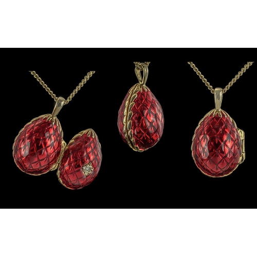 58 - Theo Faberge, Grandson of Carl Faberge, Red Enamel Silver Gilt Egg Shaped Pendant, with attached 9ct... 