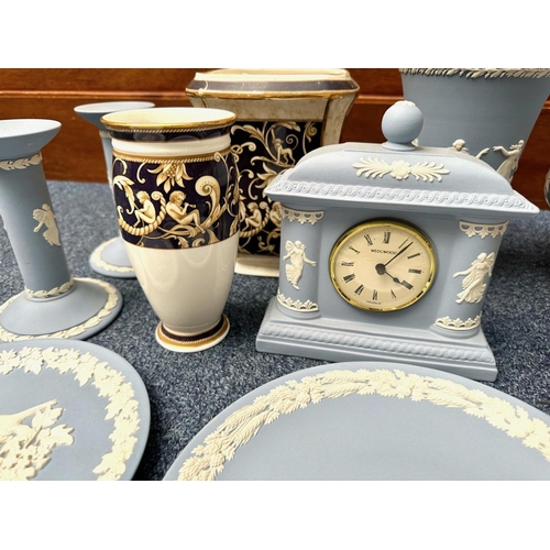 645 - Collection of Wedgwood, including 'Blue Jasper' ware bowl, vase, pair of candlesticks, mantle clock,... 