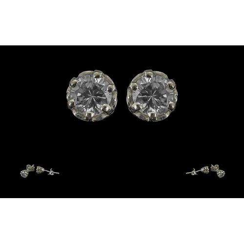 12 - 18ct White Gold - Excellent Pair of Diamond Stud Earrings. Marked 750 - 18ct. The Round Brilliant Cu... 