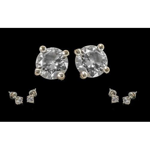 21A - Pair of 18ct White Gold Diamond Set Earrings. Marked 750 - 18ct. The Round Brilliant Cut DIamonds of... 