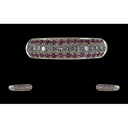 39 - Channel Set 18ct White Gold - Pleasing Quality Diamond and Ruby Set Dress Ring. Full Hallmark to Int... 