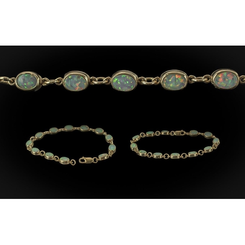 70 - Ladies - Pleasing Quality 9ct Gold Opal Set Bracelet. Marked 9.375. The Well Matched 12 Opals of Goo... 