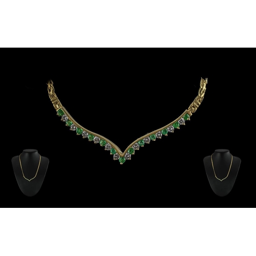 92 - Ladies - 14ct gold pleasing quality emerald and diamond set necklace. the emeralds and diamonds of e... 