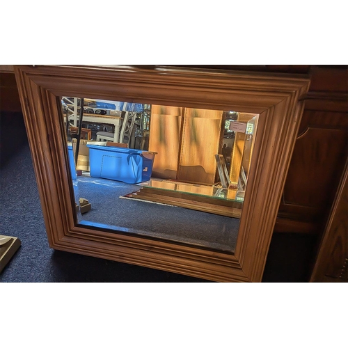 1061 - Two Large Mirrors, comprising an antique oak bevelled mirror measures 26'' x 35'', together with a p... 