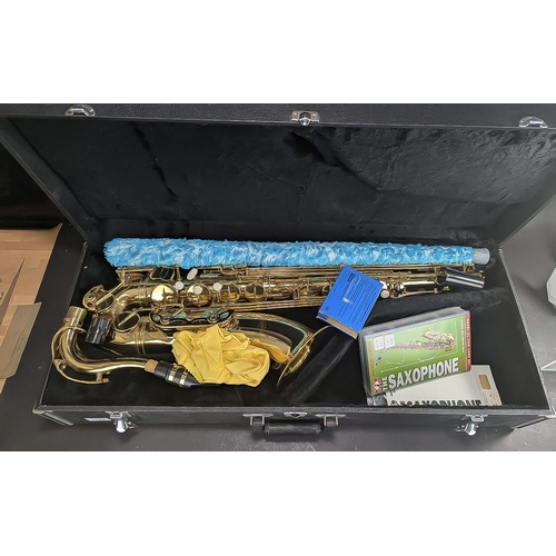 1111 - Washington Tenor Saxophone, brass with pearlised buttons, floral engraving, in fitted case.  In exce... 