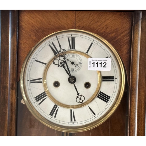 1112A - Vienna Wall Clock, double weight, porcelain dial, measures overall length 42''.