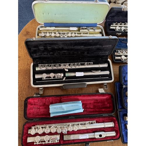 1363 - Collection of Musical Instruments to include seven flutes and five clarinets, makes to include Evett... 