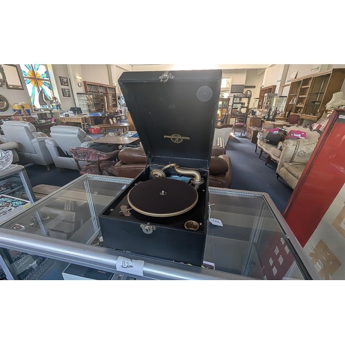 1425 - Portable Table Top Gramophone by Columbia, with crank, together with a small collection of records.