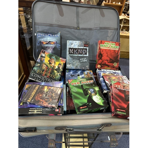 1487 - Suitcase Containing Quantity of PC Boxed Games, and associated.