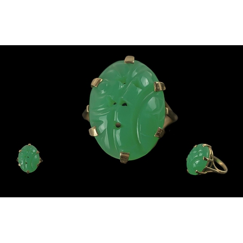 302 - Ladies Pleasing 9ct Gold Carved Jade Stone Set Ring, full hallmark to interior of shank, the jade st... 