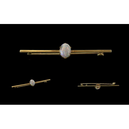 308 - A Fine Victorian Period 15ct Gold Opal Set Stick Brooch. Marked 15ct. The Central Oval Shaped Opal o... 