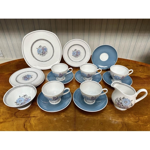 586 - Susie Cooper Bone China Tea Set, comprising five cups, six saucers, six side plates, a bread and but... 