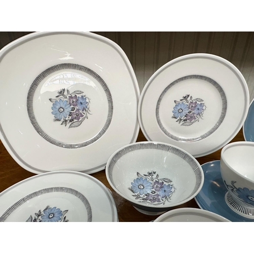 586 - Susie Cooper Bone China Tea Set, comprising five cups, six saucers, six side plates, a bread and but... 