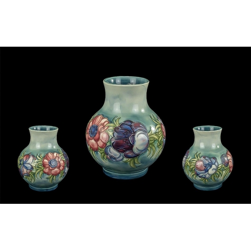 651 - Moorcroft Vase, pale blue ground with 'Anemone' pattern.  Bulbous shape, measures 8'' tall.