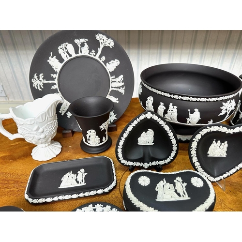 660 - Collection of Wedgwood Black Jasperware, comprising a large rose bowl, two candle sticks, a trinket ... 