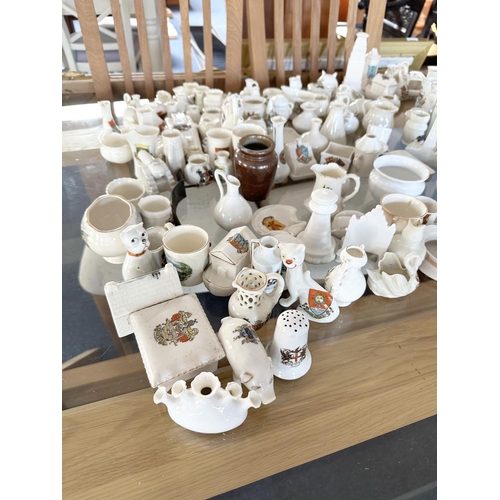 678 - Large  Collection of Crested Ware, including pots, houses, jugs, etc... Approx 150 pieces.