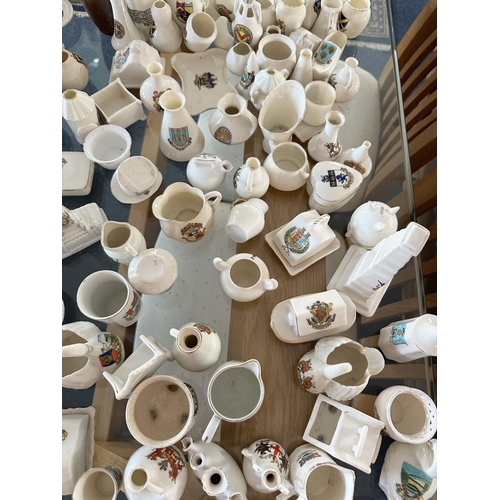 678 - Large  Collection of Crested Ware, including pots, houses, jugs, etc... Approx 150 pieces.