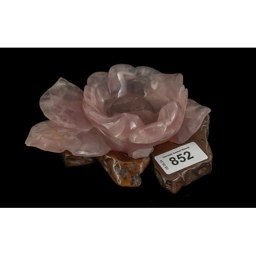 852 - Antique Chinese Carved Rose Quartz Flower, on a wooden stand, possible brush washer.  Overall 6'' le... 