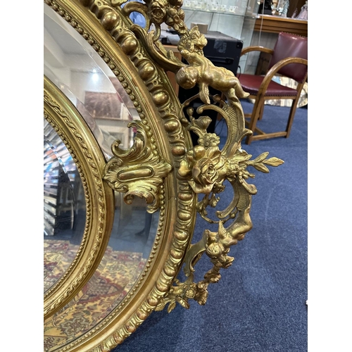 1031 - Impressive Rococo Style Oversized Mirror, Decorated In Gilt Design, Cherub Decoration Throughout. Ce... 