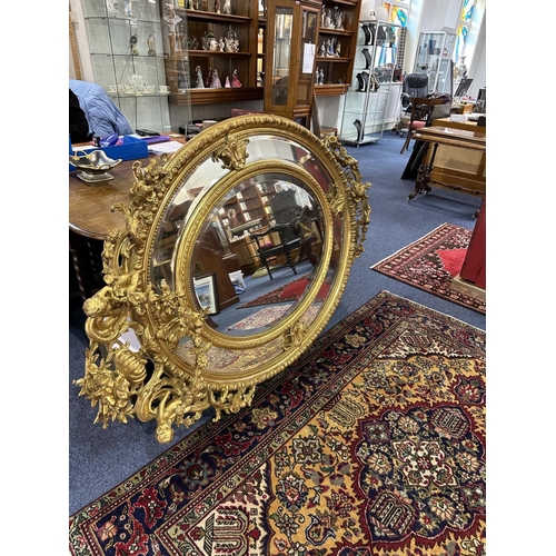 1031 - Impressive Rococo Style Oversized Mirror, Decorated In Gilt Design, Cherub Decoration Throughout. Ce... 