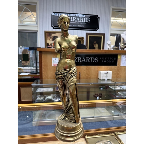 1035 - A Decorative V. Di Milo Sculpture of a Woman. 24 Inches In Height.