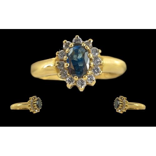 121 - Ladies 18ct Gold Sapphire and Diamond Set Cluster Ring, Marked 750 to Interior of Shank. The Central... 