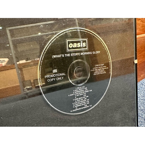 1364 - Oasis Interest - Noel and Liam Gallagher - signed drum cover, together with a framed 'What's the Sto... 