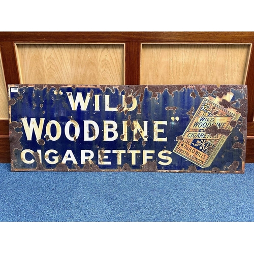 1356 - Cast Iron Enamel Sign 'Wild Woodbine Cigarettes', as found condition.  Measures 18'' x 48''.  Looks ... 