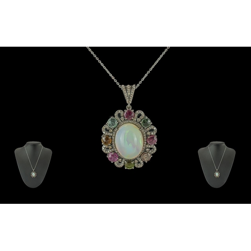 215 - Silver Pendant Set with large cabochon opal, multicolour tourmalines and rose-cut diamonds on a silv... 