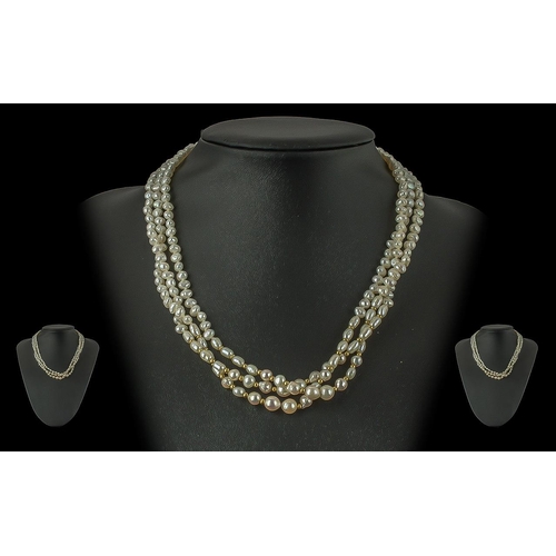 227 - Ladies - Triple Strand Freshwater Pearls and Gold Necklace, with 9ct Gold Spacers and Clasp. The Pea... 