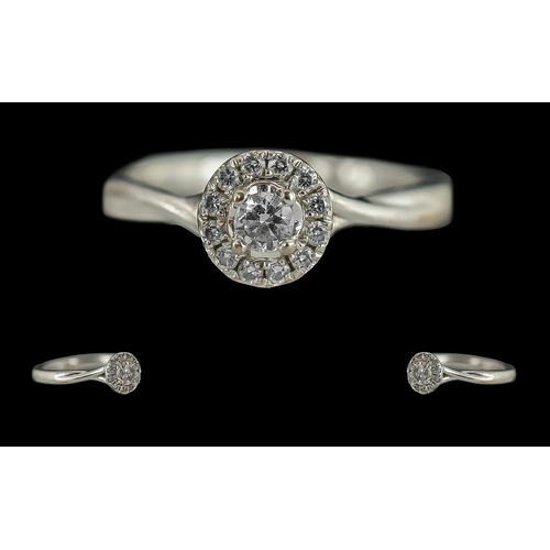 228 - Ladies 18ct White Gold Diamond Set Cluster Ring, marked 18ct to interior of shank, the small brillia... 