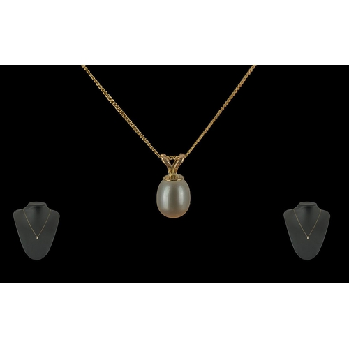 321 - 9ct Gold Pearl Drop Necklace, by Goldsmiths, with a gold bale, on a 9ct gold chain.  In original Gol... 