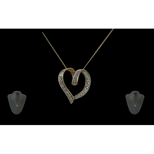 386 - 9ct Gold Heart Shaped Necklace, set with diamonds, suspended on a chain.  Marked 375 - 9 ct.