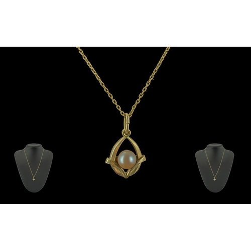 390 - 14ct Gold Pearl Pendant, suspended on a 14ct gold chain, both fully hallmarked.  Pearl set in a gold... 