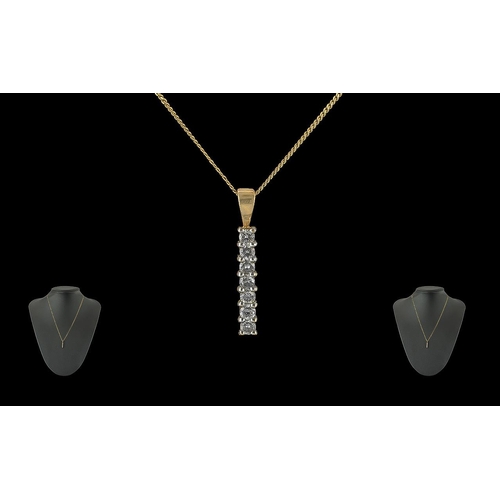 394 - 9ct Gold Bar Pendant, set with seven small diamonds, suspended on a fine chain.