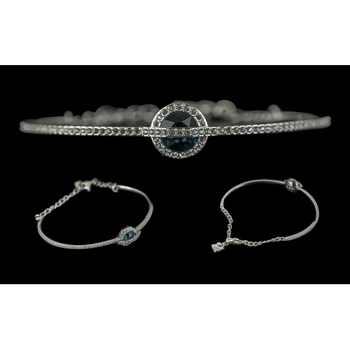 455 - Swarovski Bangle, with a circular blue stone surrounded by Swarovski crystals. In original box and o... 