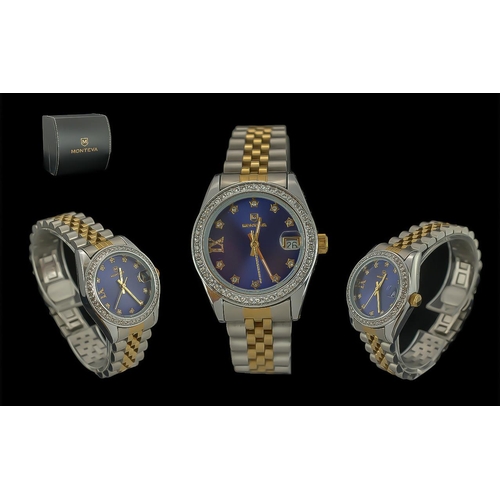 469 - Ladies Monteva Wristwatch, two tone bracelet strap, dark blue face, chrome case set with crystals, c... 