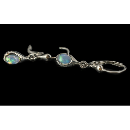 490 - Opal Solitaire Lever Back Drop Earrings, oval cabochon cut opal solitaires, each in a rub over setti... 