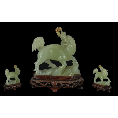 806 - Jade Carving of a mythical Foo Dog, raised on a stand.  Height 6.5'' x 6''.