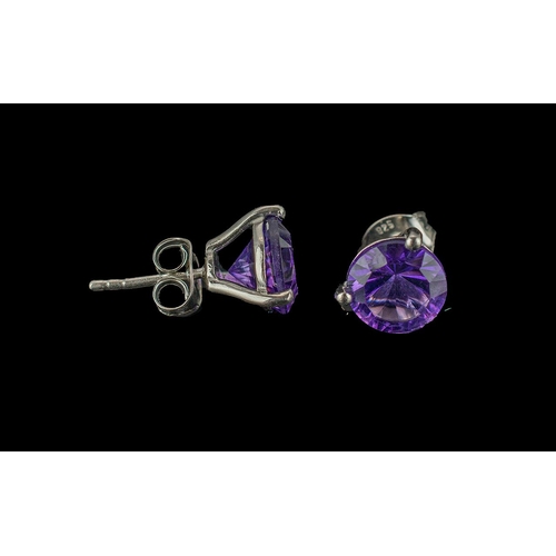 411 - Amethyst Stud Earrings, a pair of round cut solitaires of royal purple amethyst, each of 1.75cts, se... 