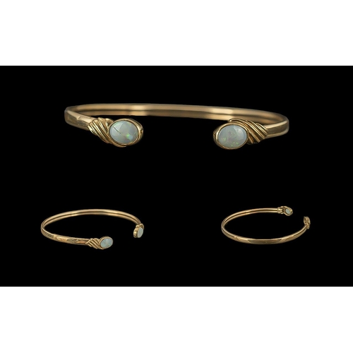 93 - Ladies 9ct Gold Pleasing Opal Set Cuff Bangle, The Opals of Pleasing Colour, Marked 9.375. The Opals... 