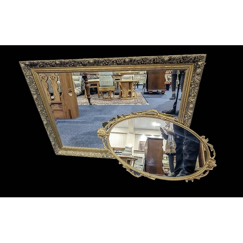 1046 - Two Decorative Mirrors, comprising a large over mantle mirror with bevelled edges, in a gold tone fr... 