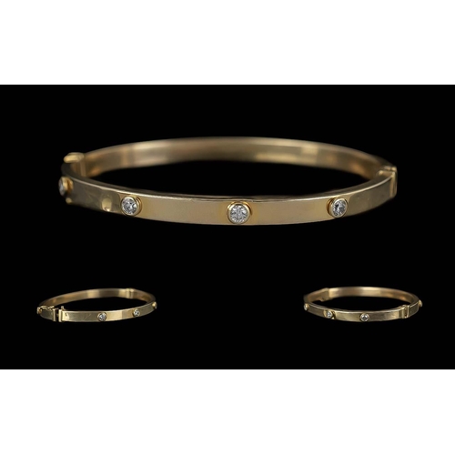 102 - Cartier Style Ladies 9ct Gold Diamond Set Hinged Bangle. Marked 9.375. The Pave Set Diamonds ( 8 ) I... 