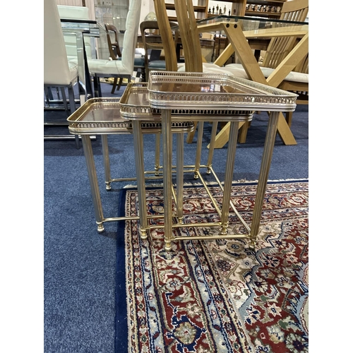 1037 - Nest of Three Tables 60's style, brown formica style top with raised filigree metal edging and metal... 