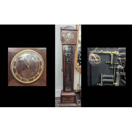 1104 - Electric Grandmother Clock, mahogany case, glazed front, with glass pendulum, chapter dial with Arab... 