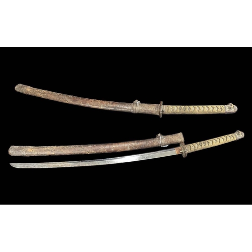 1319 - Large 19th Century Japanese Sword, in leather scabbard.  Measures approx. 40'' length.  Chagrin and ... 