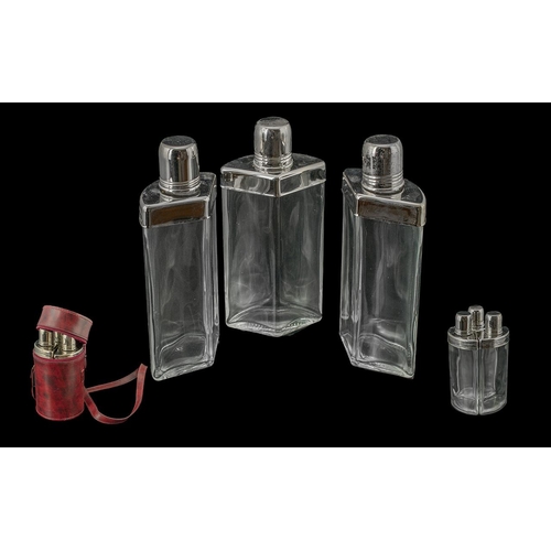 1387 - Three mid 20th Century spirit flasks, the chrome screw fitting caps opening to reveal coloured stopp... 