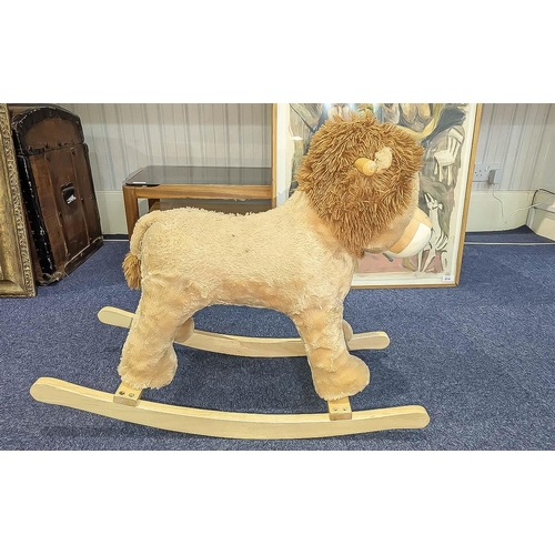 1505 - Child's Rocking Lion, raised on wooden rockers, cream fur, for the younger child, measures 24'' high... 